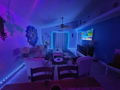 a living room with blue and purple lighting at PALM COVE VACATION HOME- One level, Community pool, Pet Friendly in Panama City Beach