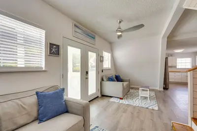 a living room with a couch and a table at Cozy 3BRand3BA • Sleeps 9 • 0 3 Mi to Beach • PCB in Panama City Beach