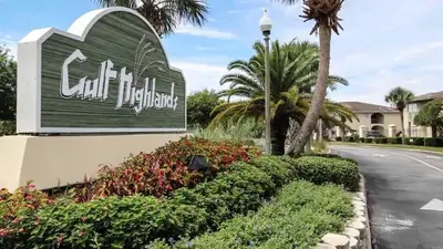 a sign for a villa at the end of a road at Gulf Highland Rentals by Panhandle Getaways in Panama City Beach