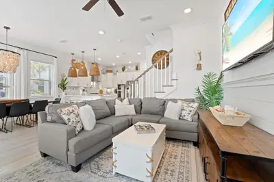 a living room with a couch and a table at Crab Cottage in Inlet Beach