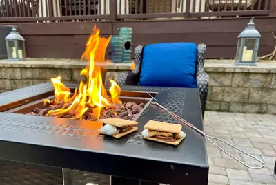 a barbecue grill with sandwiches and fires on it at Beach bliss awaits! - Beach, Pools, Tiki-Deck, Arcade, Putting green, Family Fun! in Panama City Beach