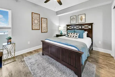 a bedroom with a bed and a ceiling fan at Majestic Beach Towers I 2002 Stay Salty in Panama City Beach