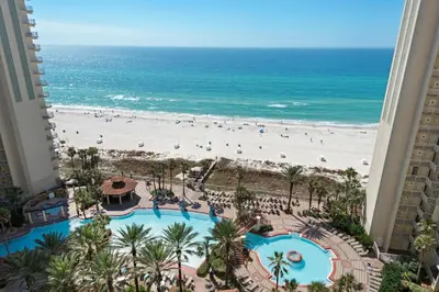 a view of the beach from the balcony of a resort at Shores of Panama 1313 in Panama City Beach