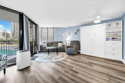a living room with a couch and a chair at Sunbird 412E in Panama City Beach
