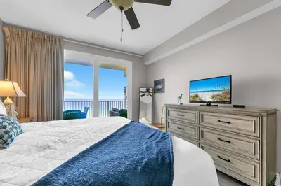 a bedroom with a bed and a flat screen tv at Laketown Wharf 1627 in Panama City Beach