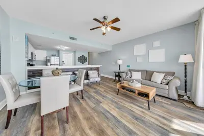 a living room with a couch and a table at Majestic Beach Towers 1-1911 in Panama City Beach