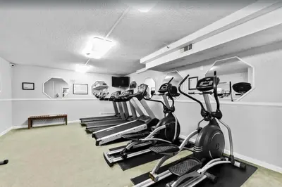 a row of treadmills in a fitness room at Summit 715 in Panama City Beach