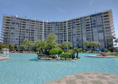 a resort with a large building in the background at Edgewater Gulf Villas 953 in Panama City Beach