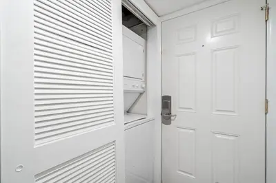 a white door in a kitchen with a stove at Sugar Beach 19C in Panama City Beach