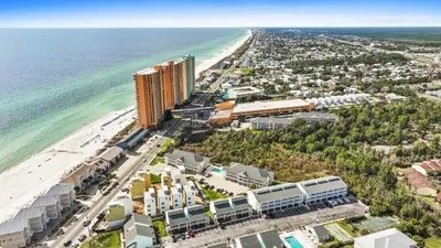 an aerial view of a beach and the ocean at Peachtree Place Condominiums by Panhandle Getaways in Panama City Beach