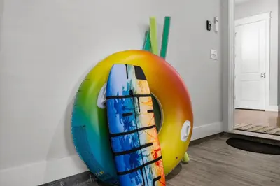 a large colorful sculpture of a building on a wall at 30A Pet Friendly Beach House - 33 Sunset by Panhandle Getaways in Rosemary Beach