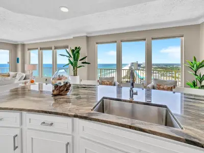 a kitchen with a sink and views of the ocean at Gulf Crest 2107A in Panama City Beach