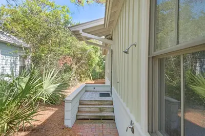 a stairway leading up to a house at Magnolia Cottage in Inlet Beach