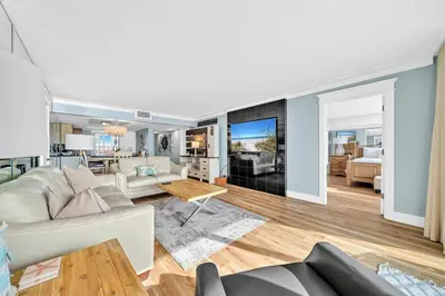 a living room with a couch and a table at Edgewater Tower 2-404 in Panama City Beach