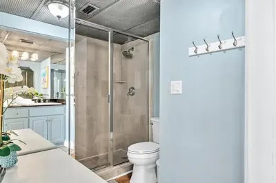 a bathroom with a shower and a toilet at Edgewater Tower 2-404 in Panama City Beach