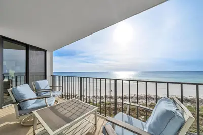 a balcony with chairs and a view of the ocean at Edgewater Tower 2-404 in Panama City Beach