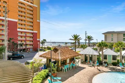 a resort with a swimming pool and a hotel at Calypso 3-202 - The Sea Suite in Panama City Beach