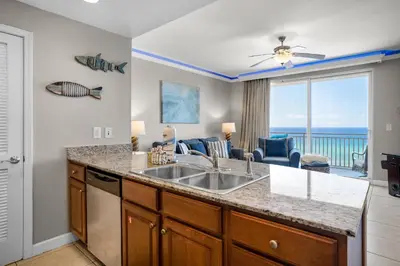 a kitchen with a sink and a view of the ocean at Splash 603E in Panama City Beach