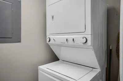 a white washer and dryer in a white room at Splash 603E in Panama City Beach