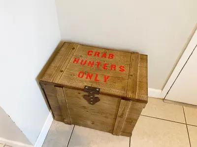 a wooden chest with the words girls hunters only written on it at Splash 603E in Panama City Beach