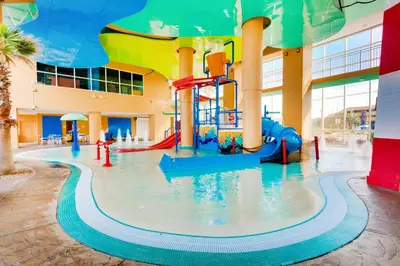 a water park with a water slide in a building at Splash 603E in Panama City Beach