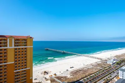 a view of the beach from the balcony of a building at Calypso 3-2307 in Panama City Beach
