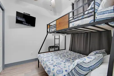 a bedroom with two bunk beds in a room at Calypso 3-2307 in Panama City Beach