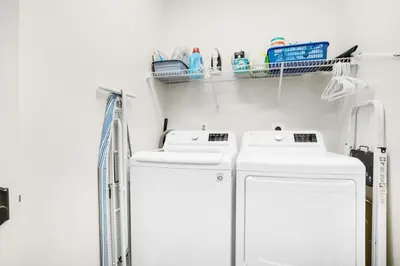 a laundry room with two washer and dryer at Pearl Flamingo in Panama City Beach