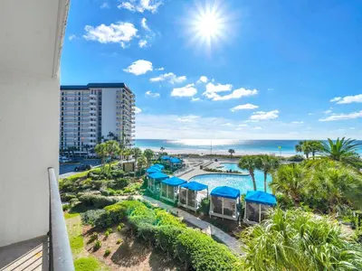 a view of the pool and beach from the balcony of a resort at Edgewater Tower 1-305 in Panama City Beach