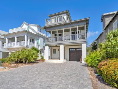 a large white house with a driveway at Churchill Dunes in Inlet Beach