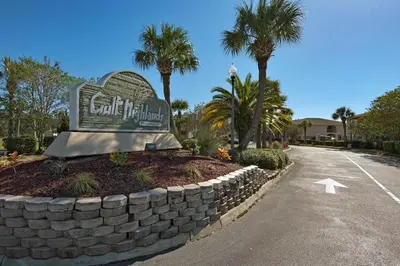 a sign for a hotel on the side of a road at Gulf Highlands 116H in Panama City Beach