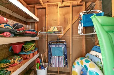 a room with wooden walls and shelves with utensils at Portside R4 in Panama City Beach