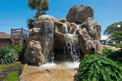 a water fountain in a yard with a waterfall at Portside R4 in Panama City Beach