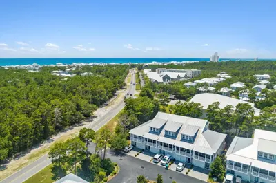 an aerial view of a building with the ocean in the background at 30A Townhomes at Seagrove by Panhandle Getaways in Santa Rosa Beach