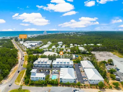 an aerial view of a city with buildings and the ocean at 30A Townhomes at Seagrove by Panhandle Getaways in Santa Rosa Beach