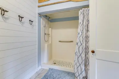 a bathroom with a shower and a shower curtain at Panama City Home with Beach Gear and 2 Bikes in Panama City