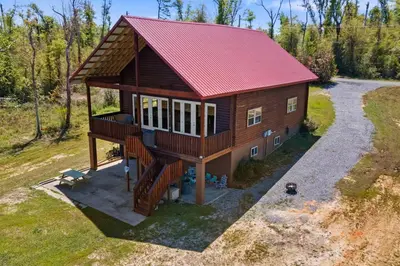 an overhead view of a house with a red roof at Fun fishing river cabin 23mi to beach with private dock 3BD 2BA in Youngstown