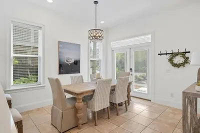 a dining room with a wooden table and chairs at Seacrest Getaway in Rosemary Beach