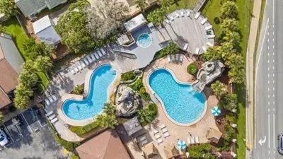 an overhead view of two pools at a resort at Portside Resort Pet Friendly Rentals by Panhandle Getaways in Panama City Beach
