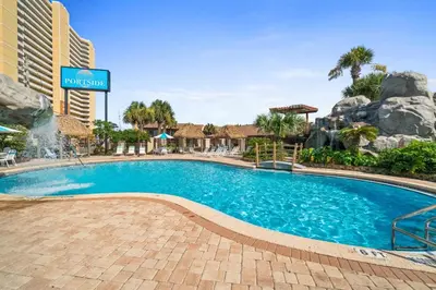 a swimming pool at a hotel with a resort at Portside Resort Pet Friendly Rentals by Panhandle Getaways in Panama City Beach