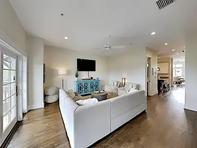 a living room with a white couch and a tv at Eastern Lake Village #E - Just 4 Fun in Seagrove Beach