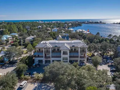 an aerial view of a large house with a parking lot at Eastern Lake Village #E - Just 4 Fun in Seagrove Beach