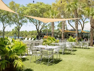 a group of tables and chairs in a park at Eastern Lake Village #E - Just 4 Fun in Seagrove Beach