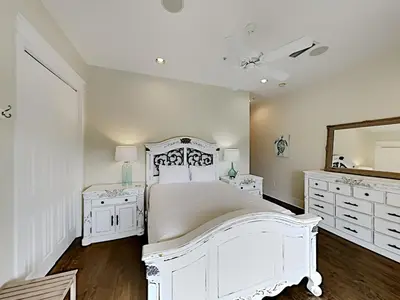 a white bedroom with a white bed and a mirror at Eastern Lake Village #E - Just 4 Fun in Seagrove Beach