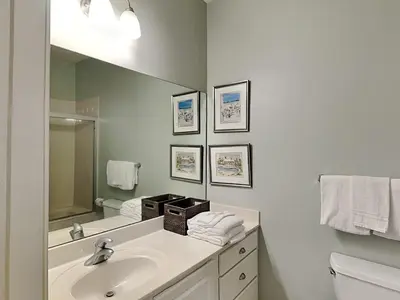 a white bathroom with a sink and a mirror at Inn at Seacrest #203 - 30A Get-A-Way in Rosemary Beach
