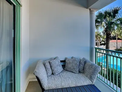 a couch on a balcony with a view of the ocean at Inn at Seacrest #203 - 30A Get-A-Way in Rosemary Beach