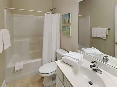 a bathroom with a toilet and a sink and a shower at Seagrove Highlands #2104 in Santa Rosa Beach
