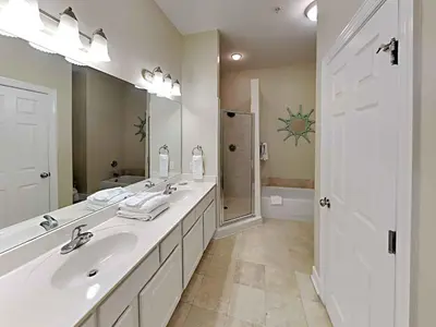 a bathroom with two sinks and a large mirror at Seagrove Highlands #2104 in Santa Rosa Beach