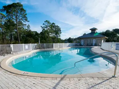 a large swimming pool with a white fence around it at Seagrove Highlands #2104 in Santa Rosa Beach