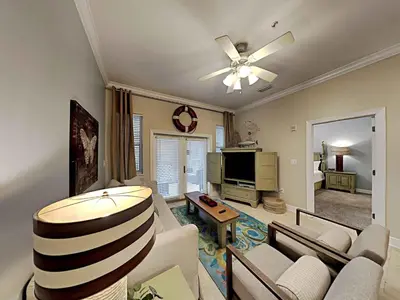 a living room with a couch and a ceiling fan at Seagrove Highlands #2104 in Santa Rosa Beach